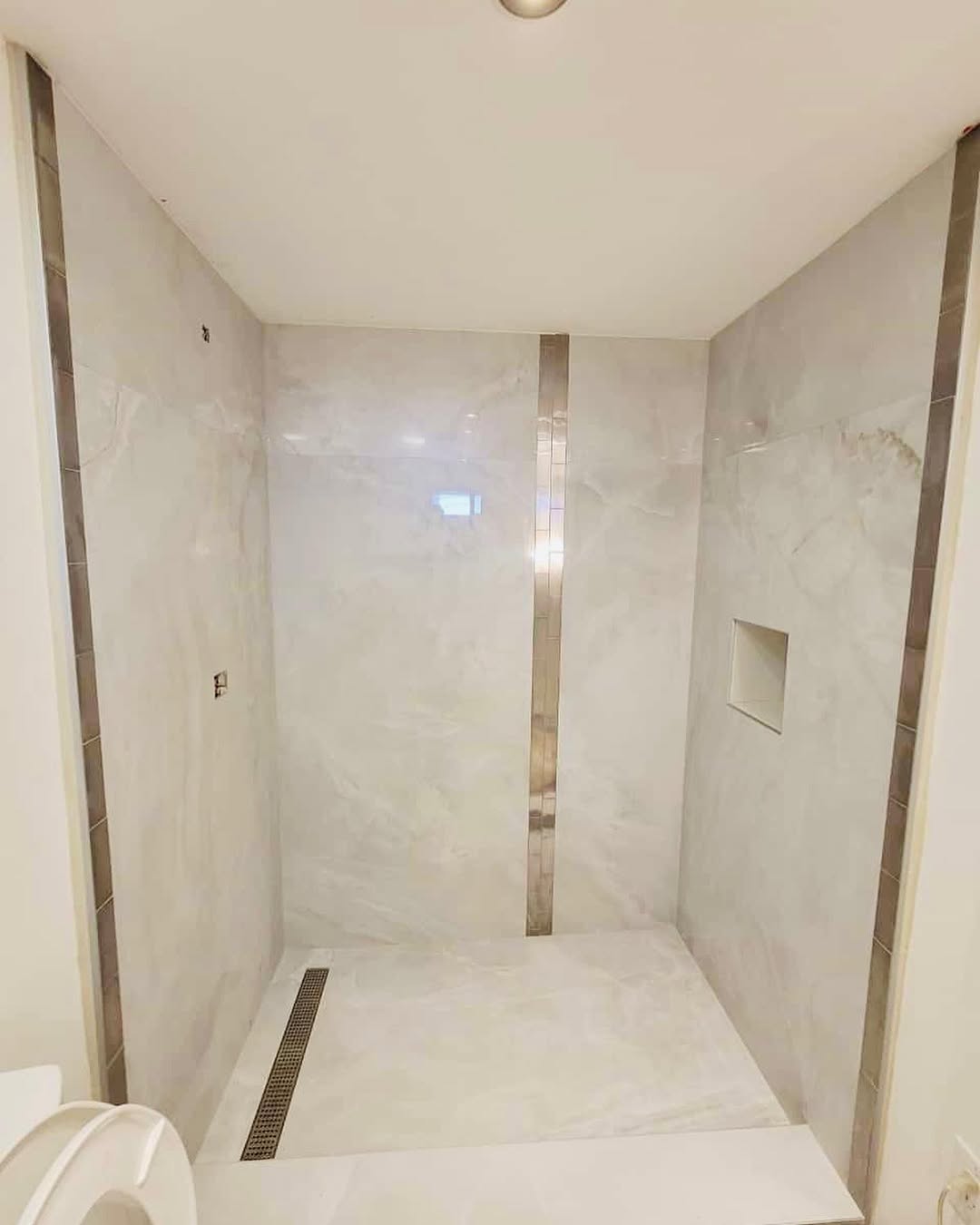 Custom curbless shower with frameless glass